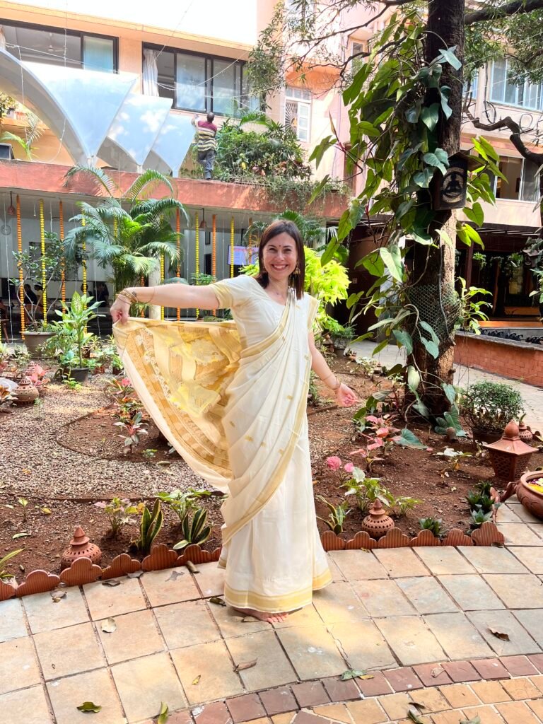 Emilie yoga therapist wearing traditional Indian sari at The Yoga Institute Mumbai