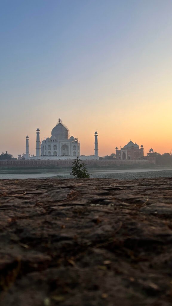Taj Mahal at sunset viewed from the Yamuna river banks, Agra, India